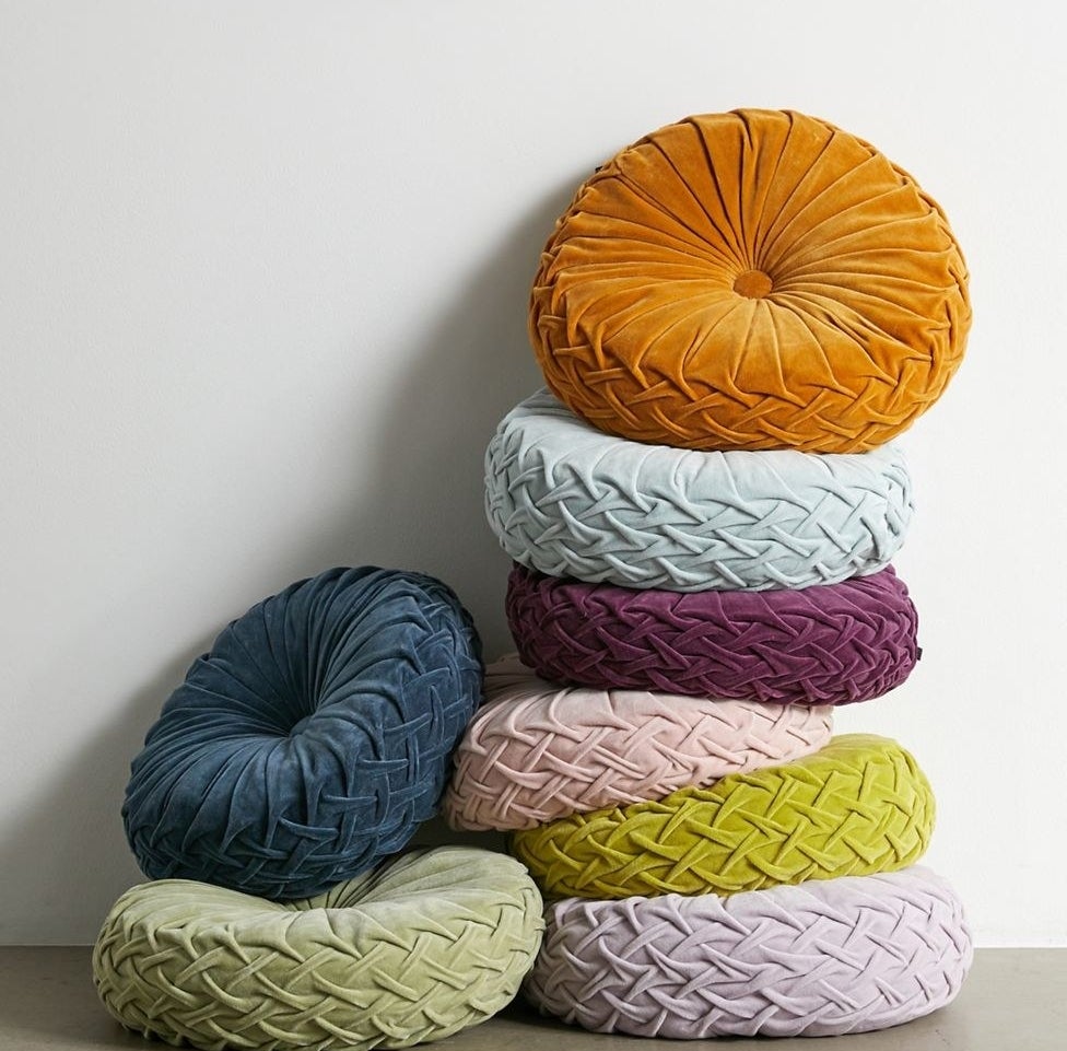 a stack of the multicolored pillows