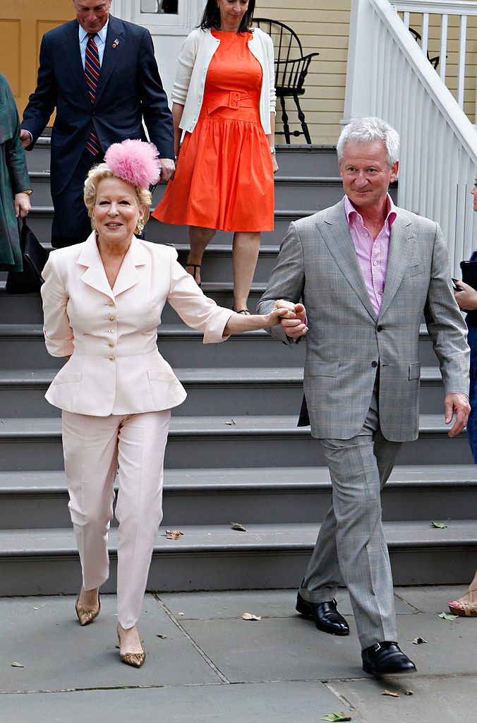Bette and Martin holding hands as they walk