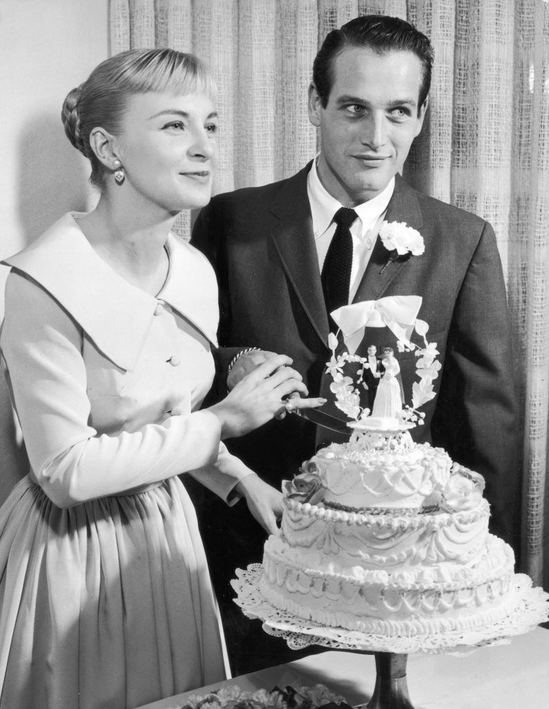 Paul and Joanne cutting their wedding cake