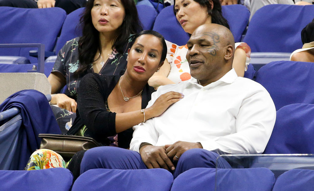 Lakiha and Mike sitting next to other at a sporting event