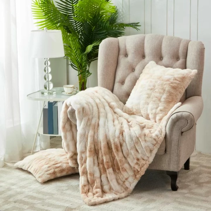 Faux fur draped over an armchair
