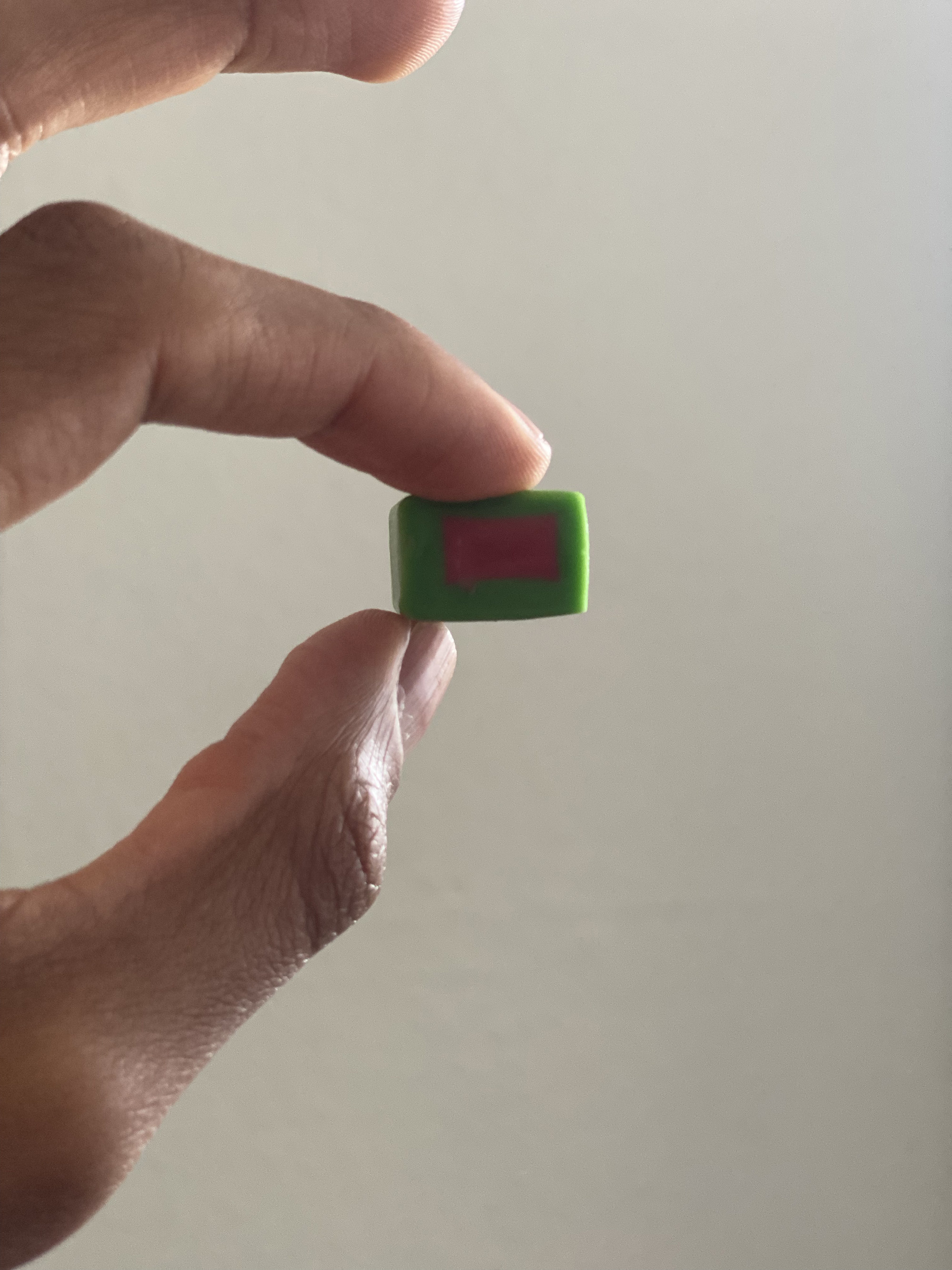 a large square of gum with two different colors for the watermelon flavor