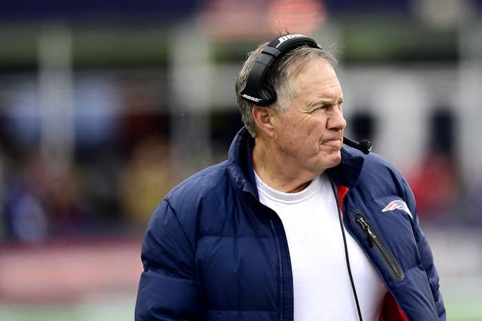 Bill Belichick in a white tee and jacket