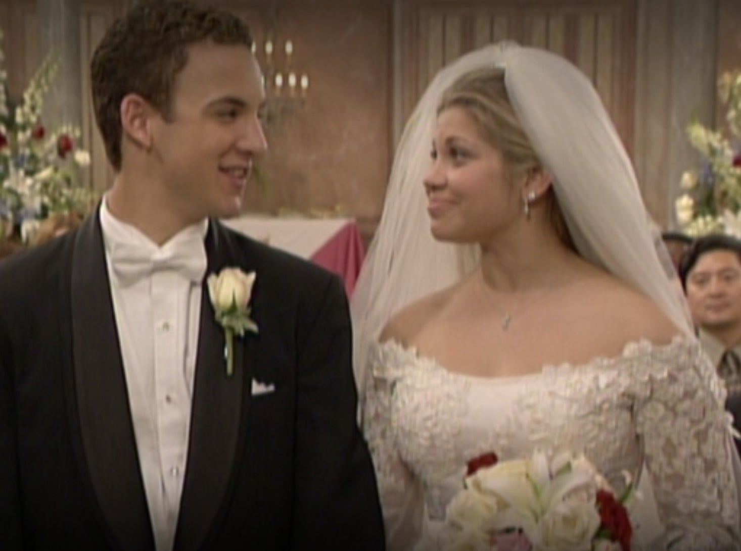 Cory and Topanga smile at each other during their wedding ceremony