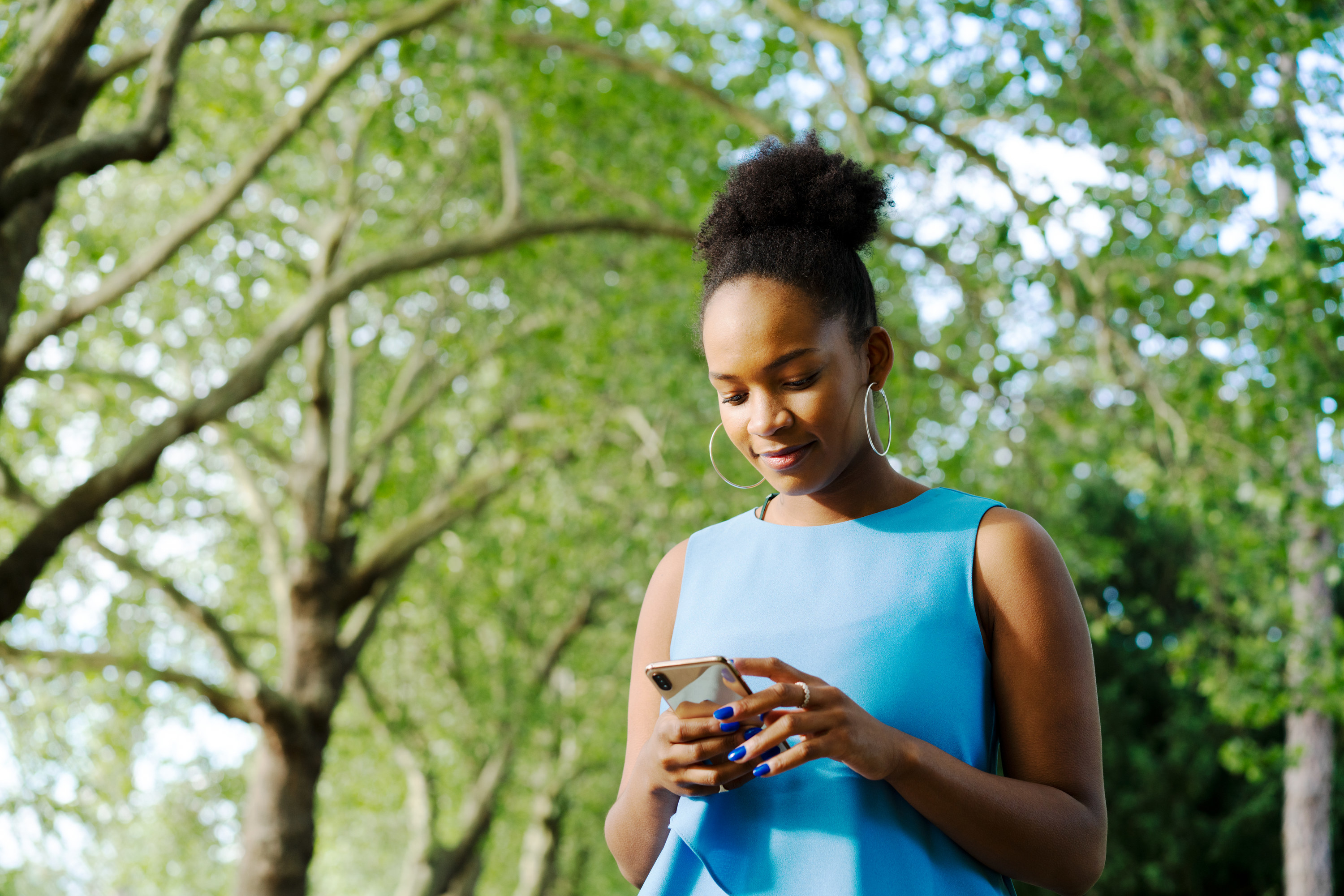 Young woman looking at her smartphone