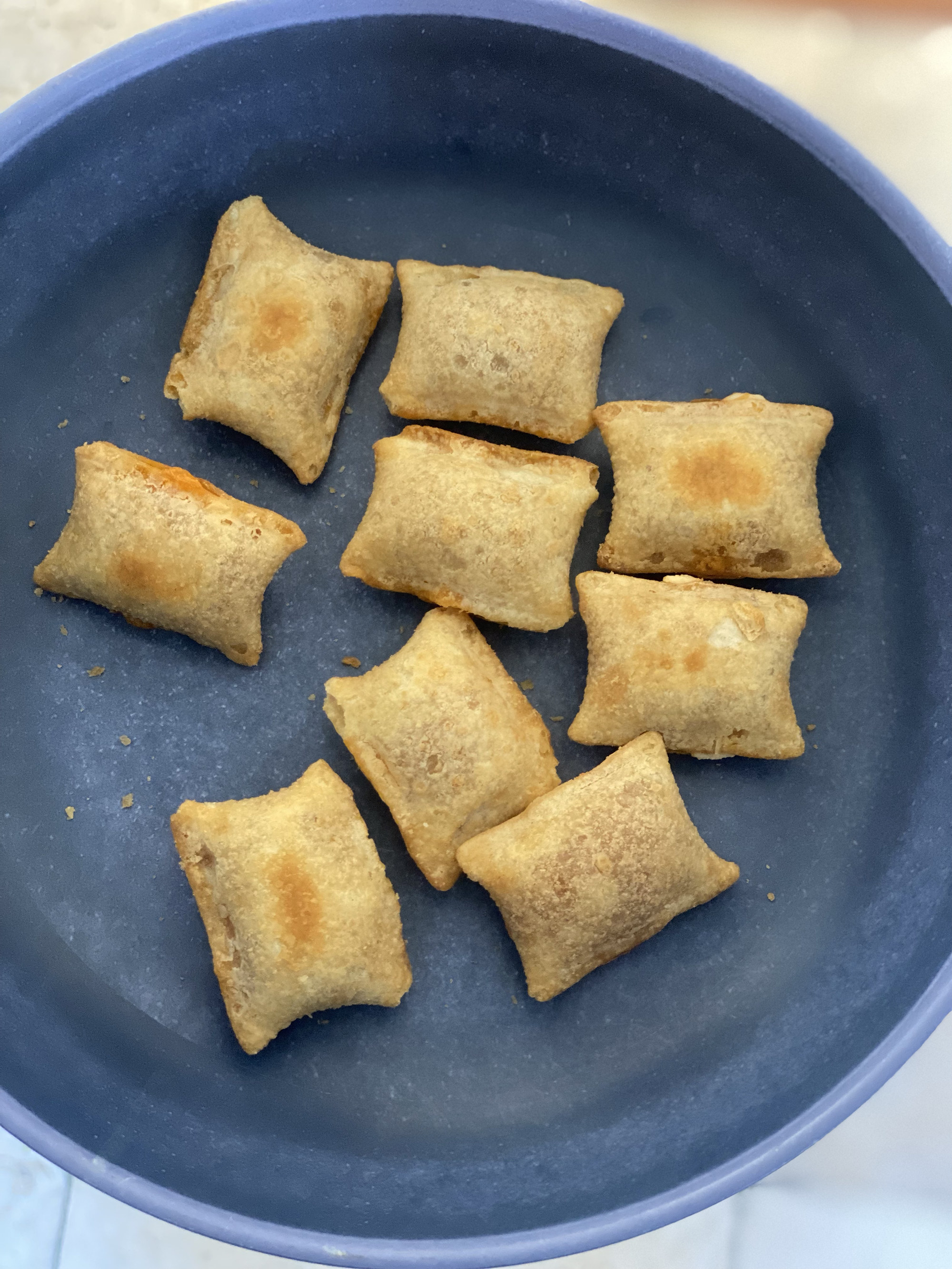 plate of tiny squares of pizza rolls