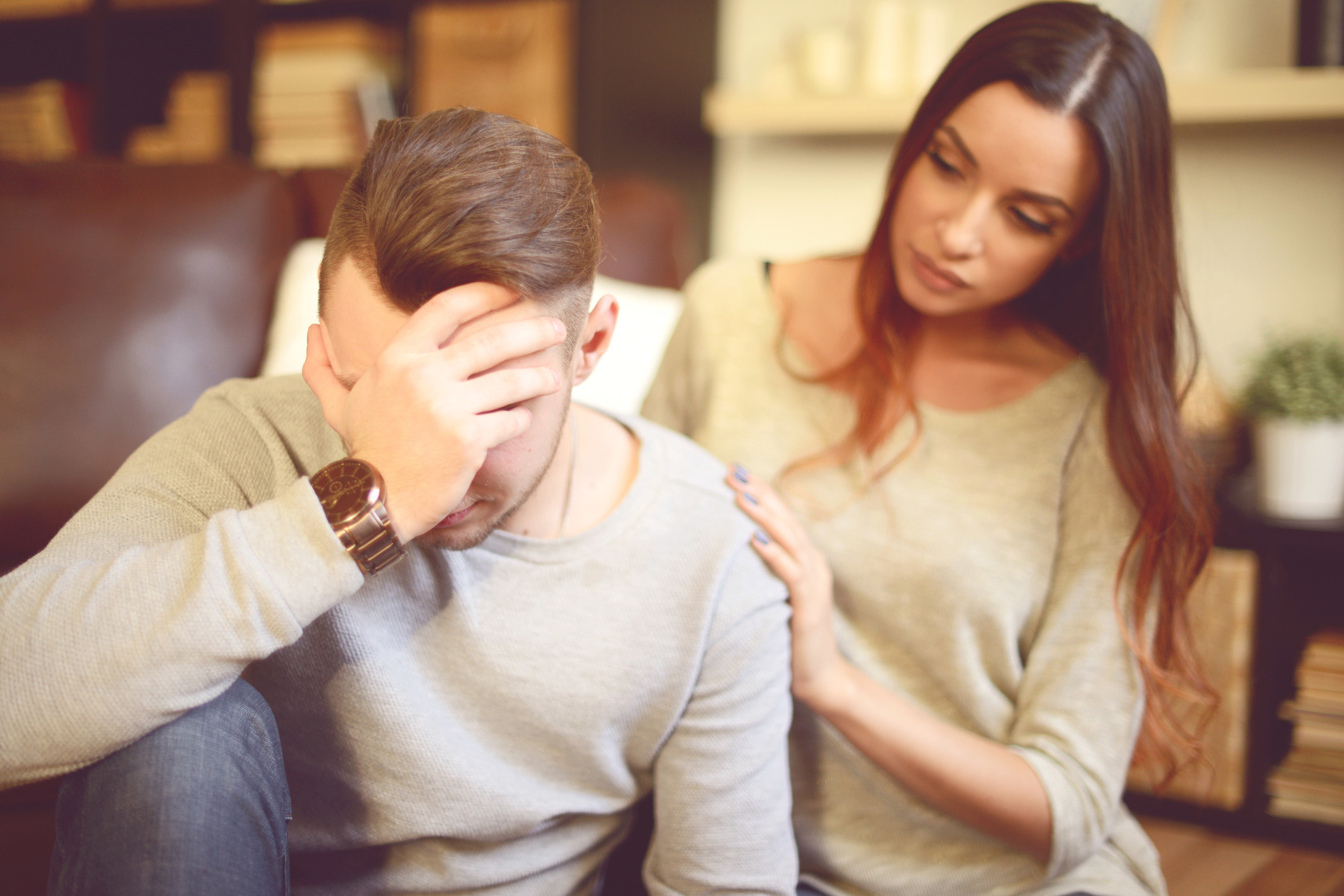 A woman trying to console a man who&#x27;s visibly upset.