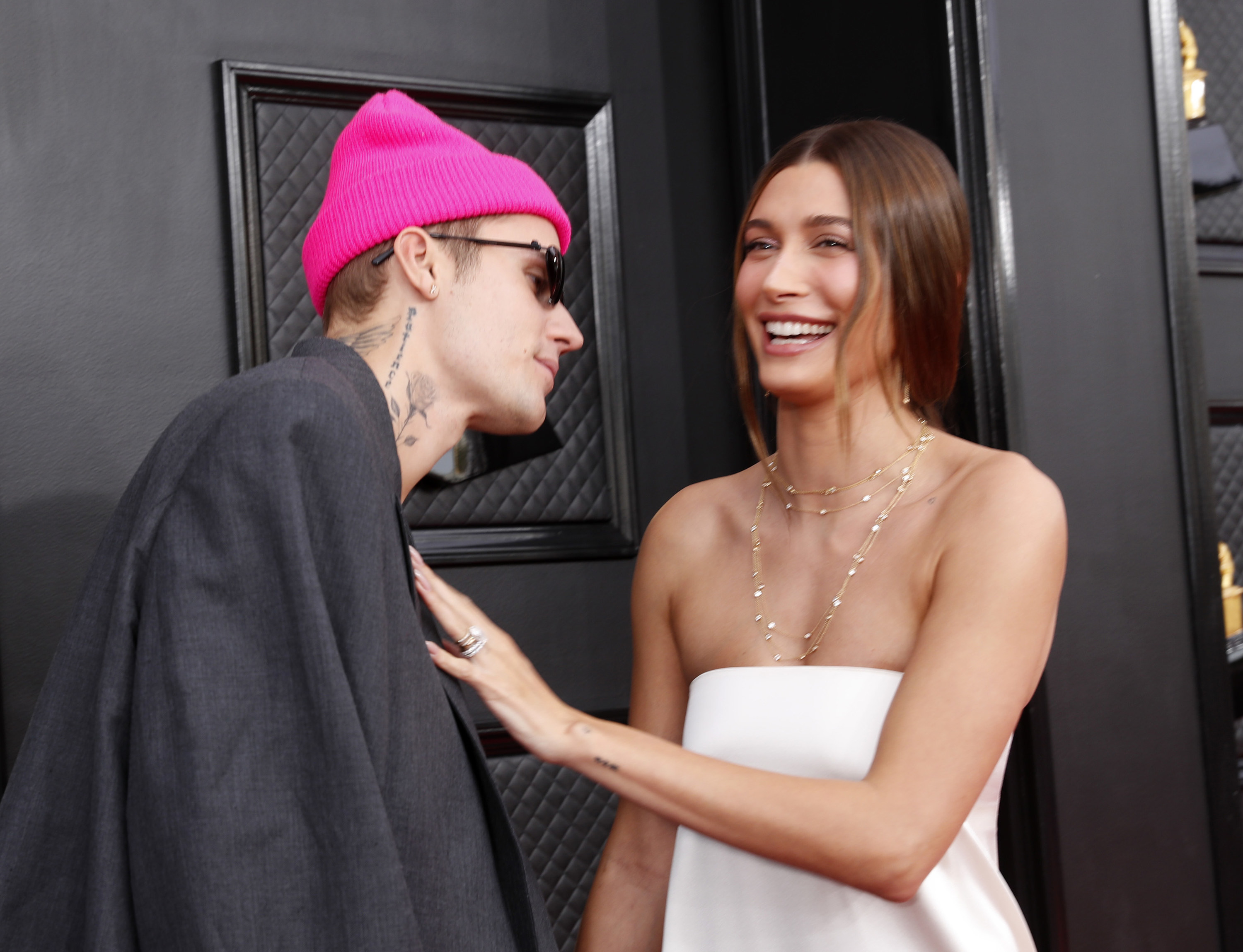 Justin leans in toward a smiling Hailey