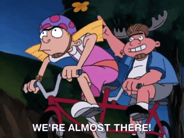 Gif of Harold from Hey Arnold riding a tandem bike with Helga shouting, &quot;we&#x27;re almost there&quot;