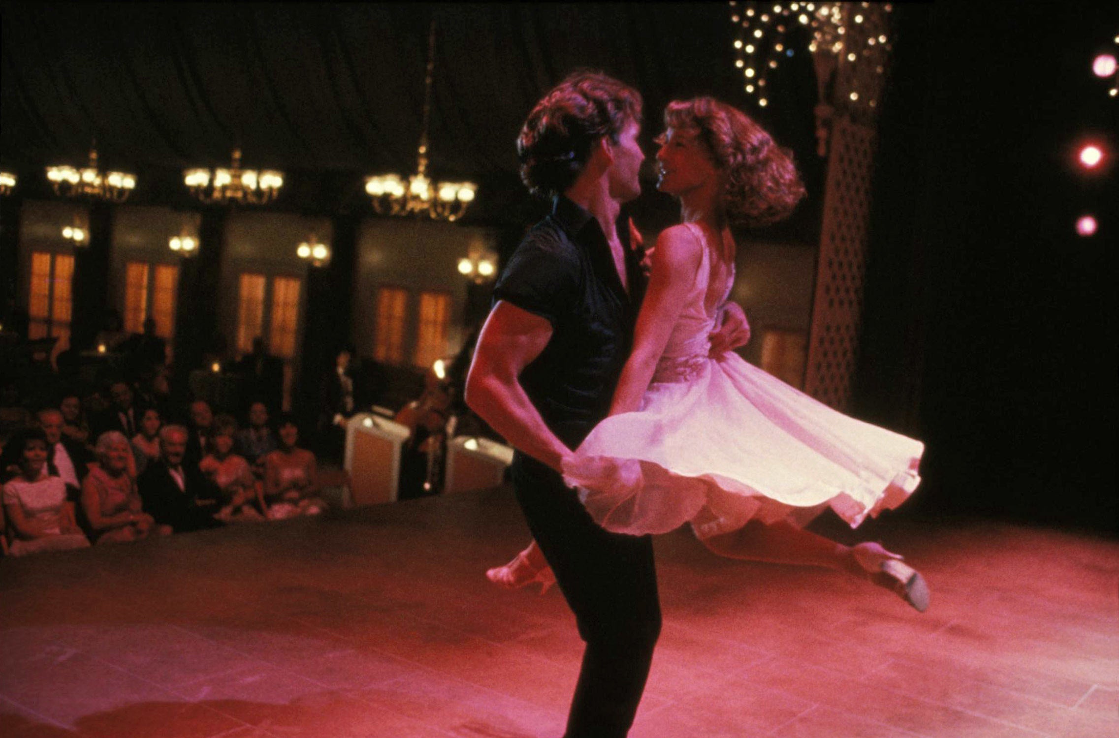 Patrick Swayze and Jennifer Grey dance on a stage together