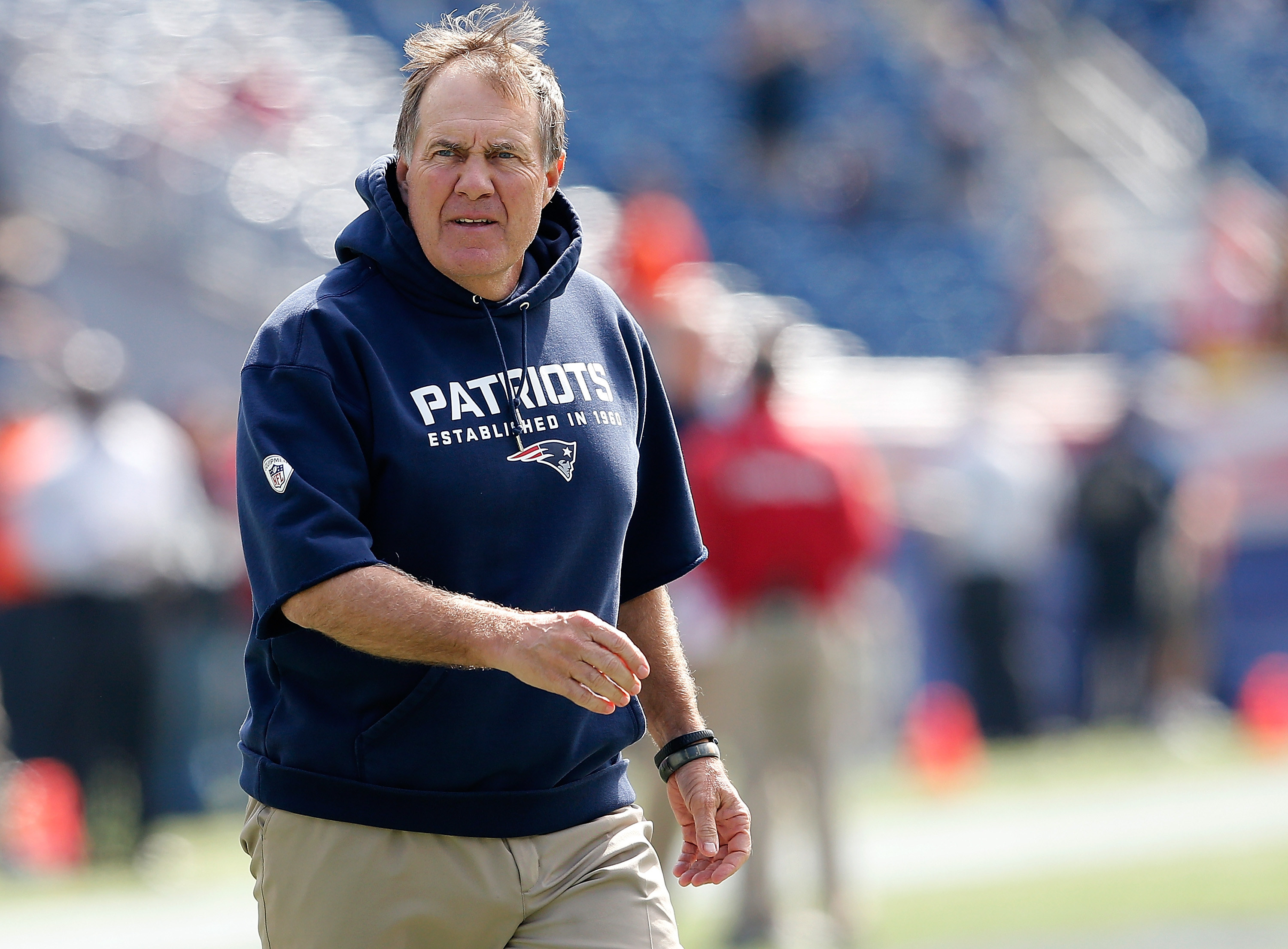 Bill Belichick in khakis and cut off sweater