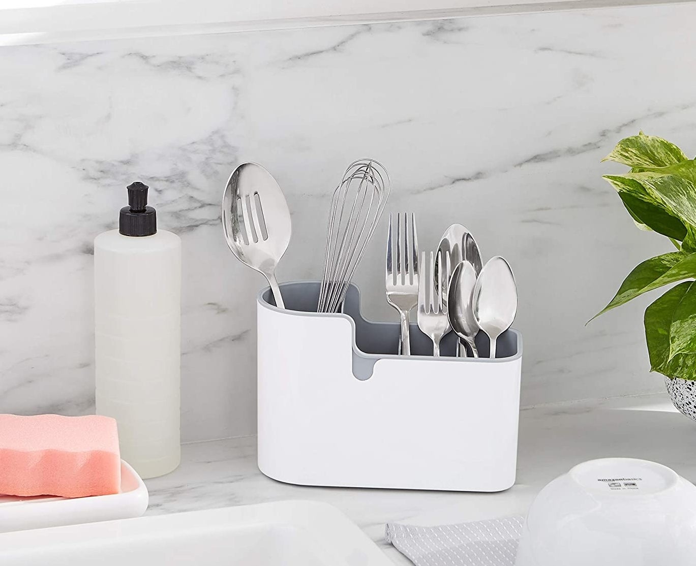 the countertop organizer filled with forks and knives