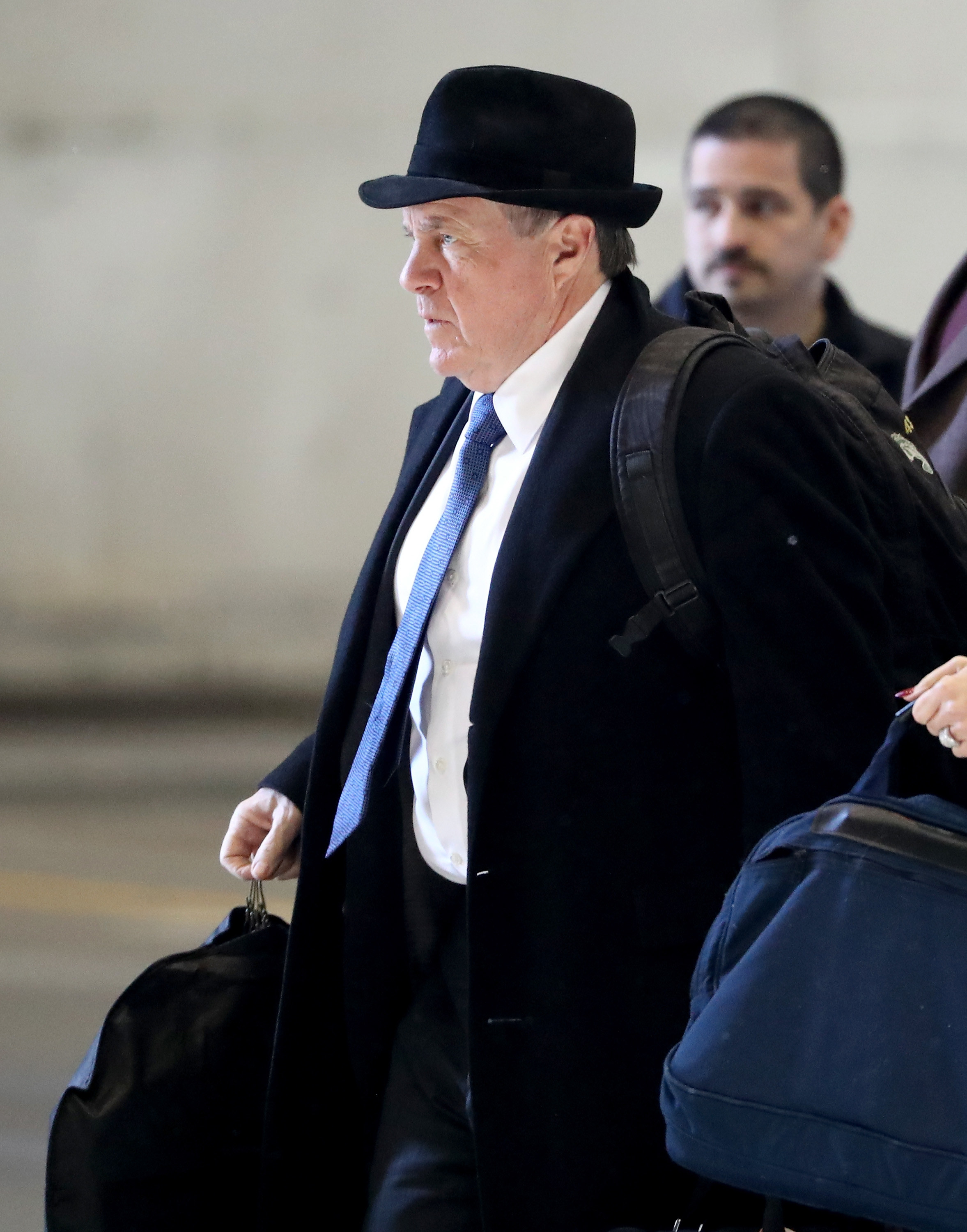 Bill Belichick in a fedora and suit