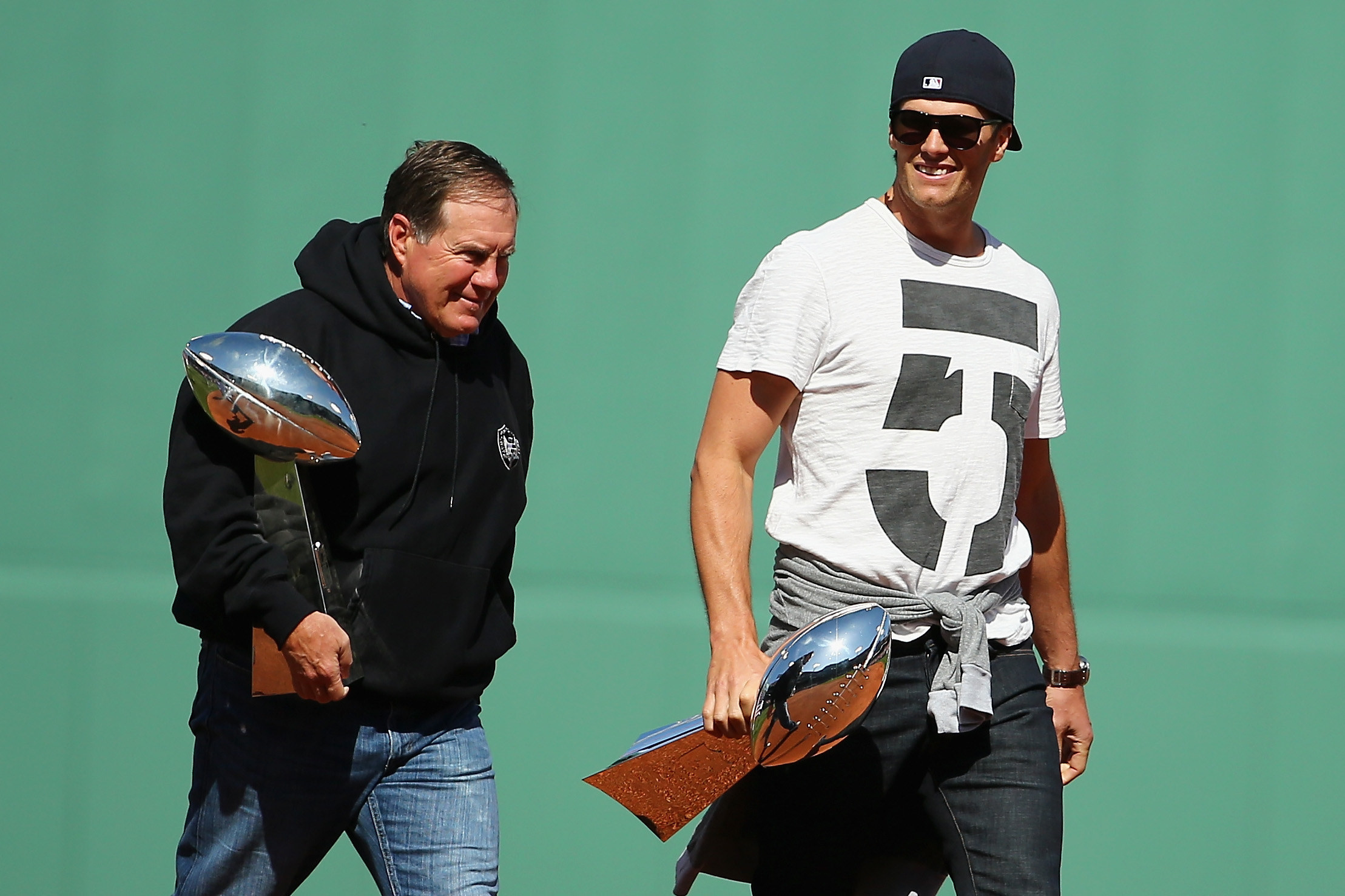 Bill Belichick with Lombardi Trophy, jeans, and a black hoodie