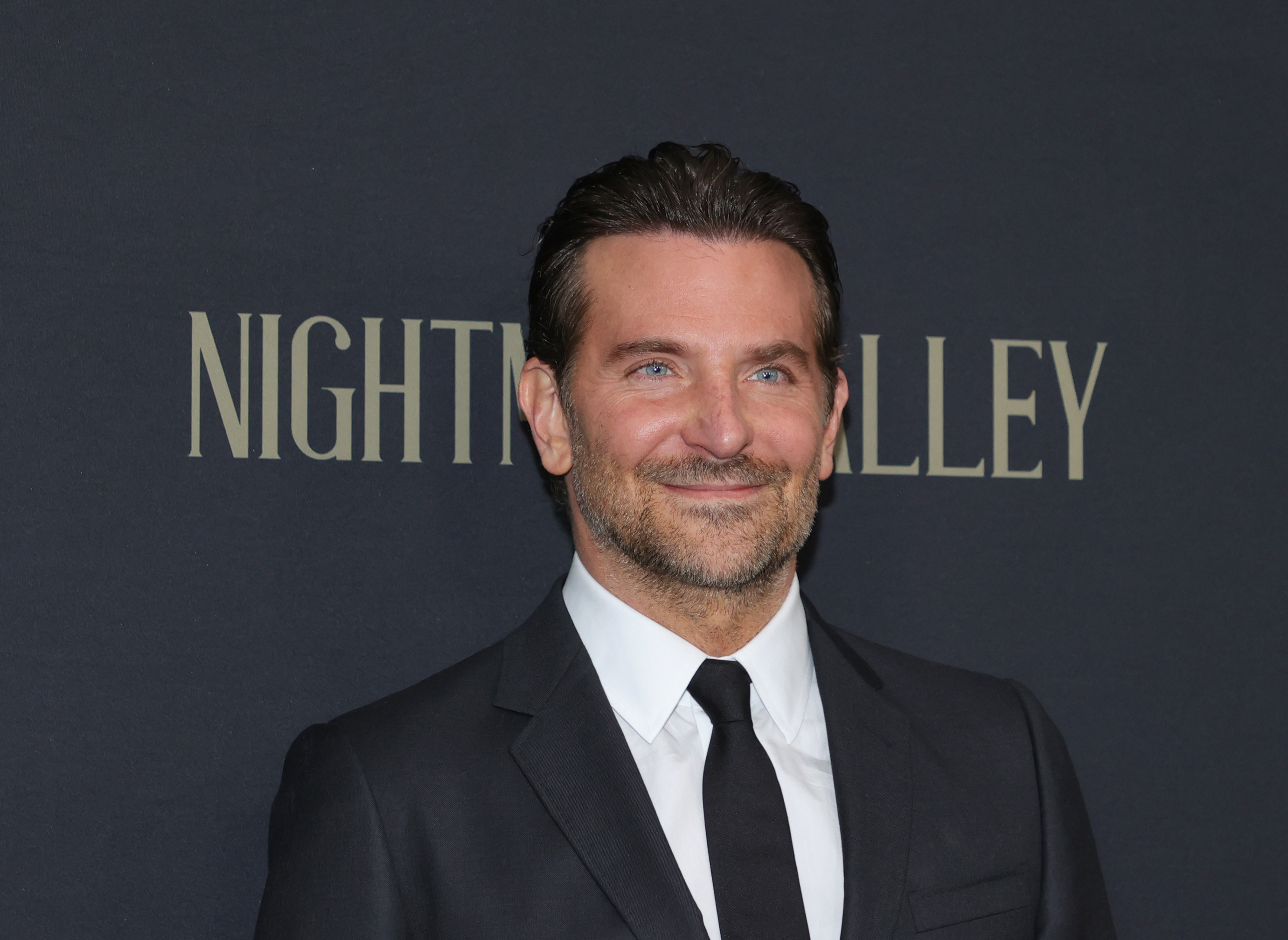 Bradley Cooper smiles at the &quot;Nightmare Alley&quot; premiere in 2021