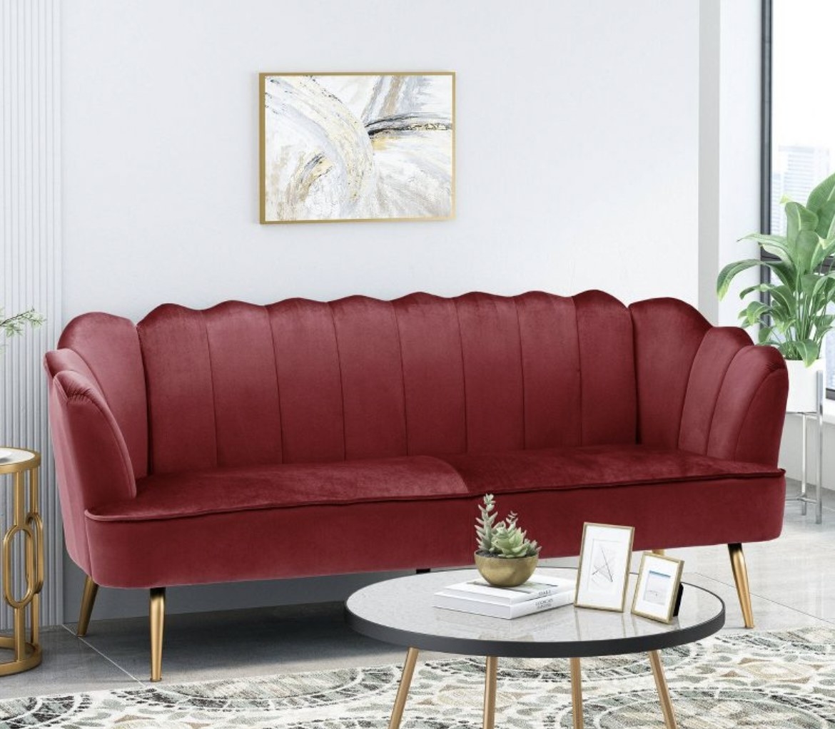 A red velvet shell sofa.
