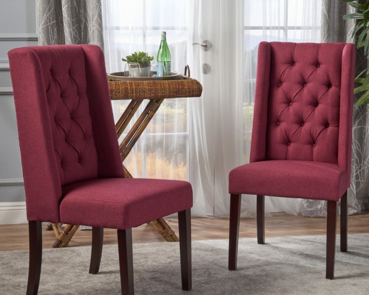 Red tufted dining chairs.