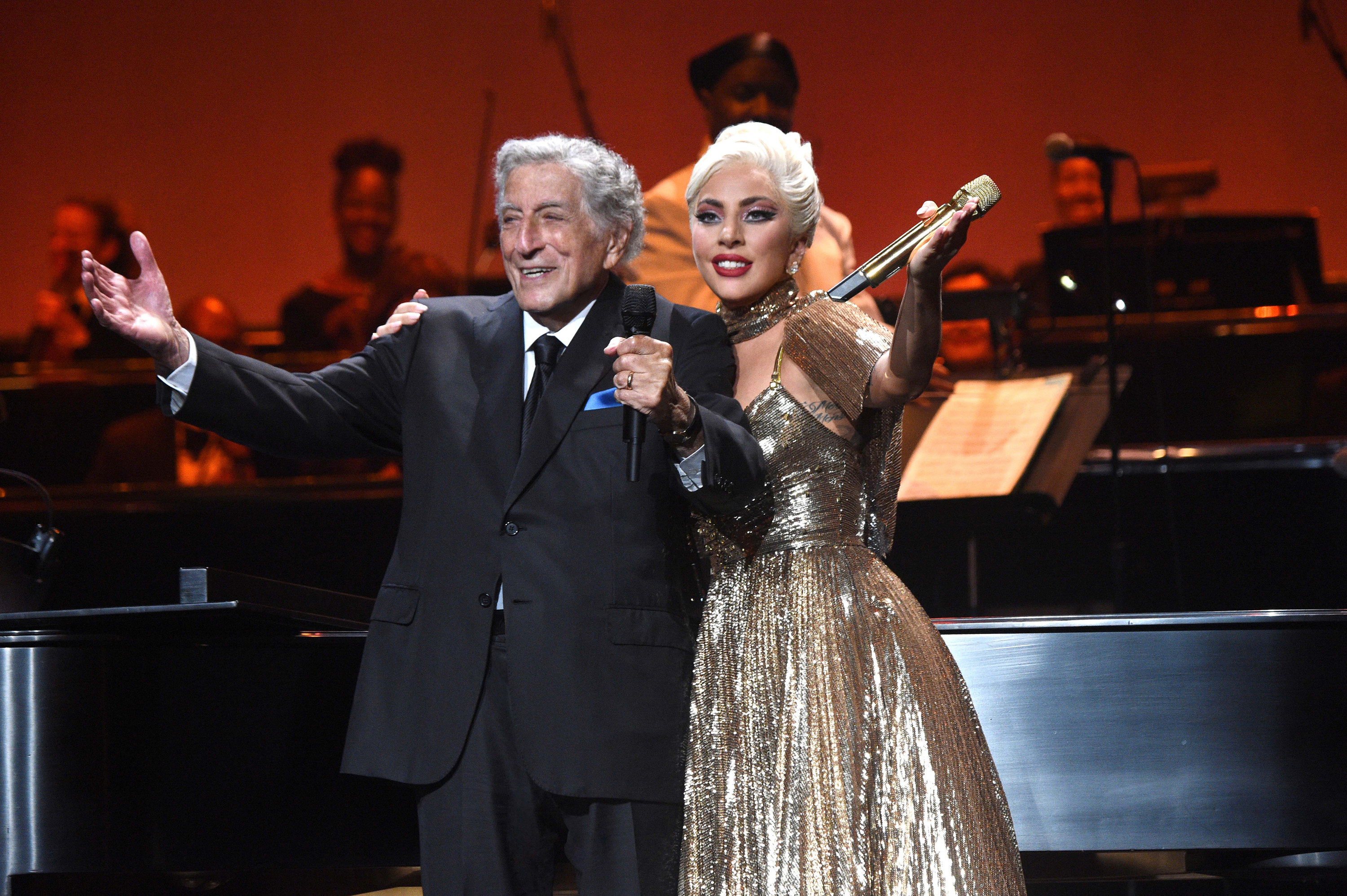 Gaga and Tony stand on stage together