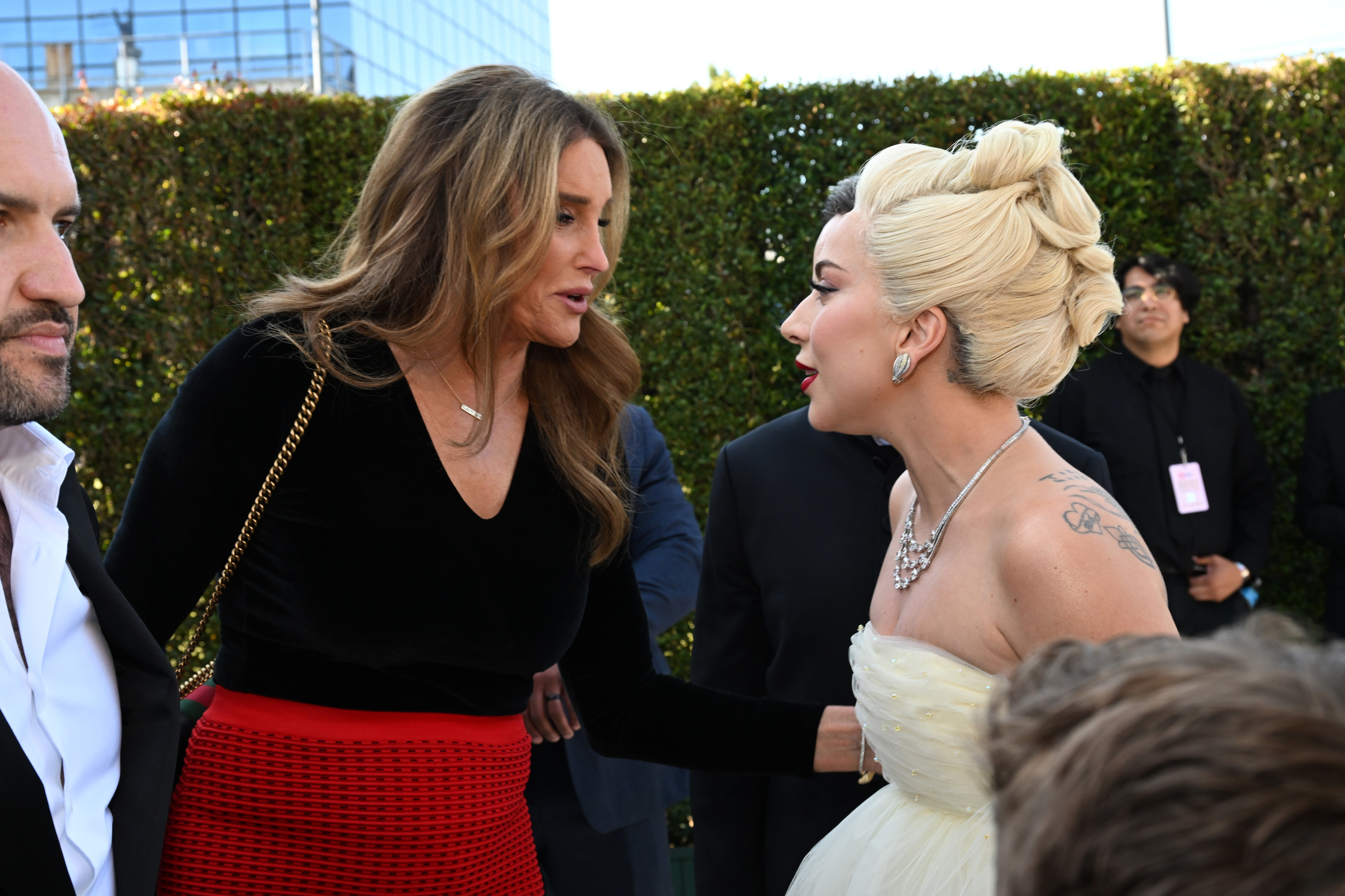 Caitlyn Jenner and Lady Gaga speaking at Elton John&#x27;s Academy Awards viewing party.