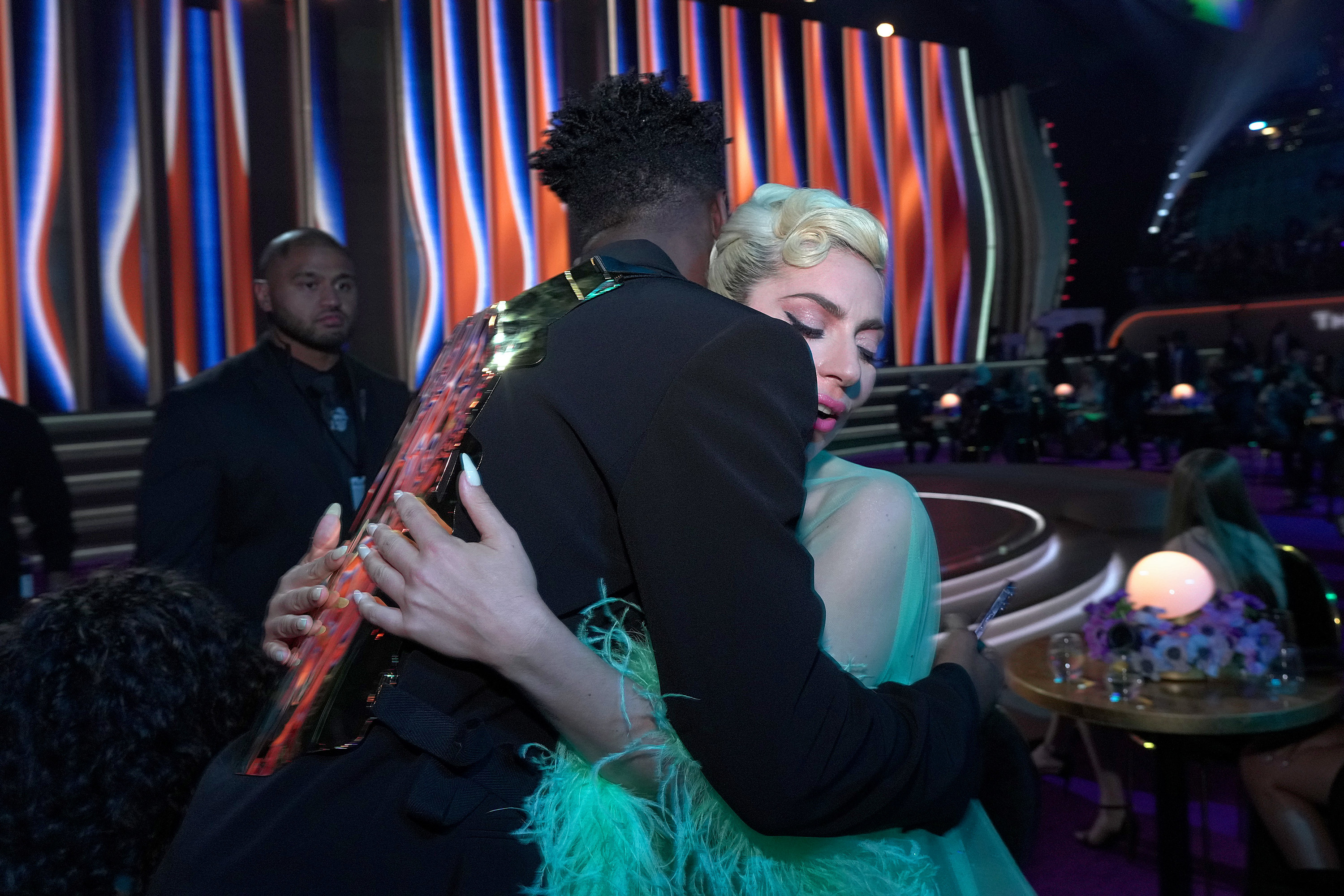 Lady Gaga giving a hug at the 2022 Grammys.
