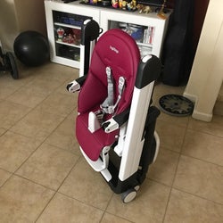 reviewer's photo of the high chair folded up