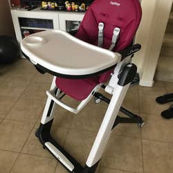 reviewer's photo of the high chair in berry color