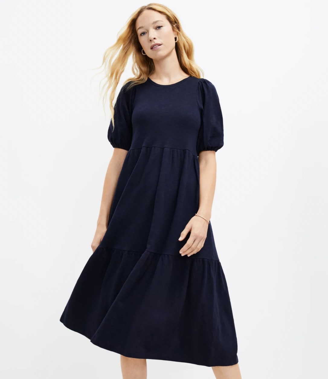 Model in the navy blue midi dress