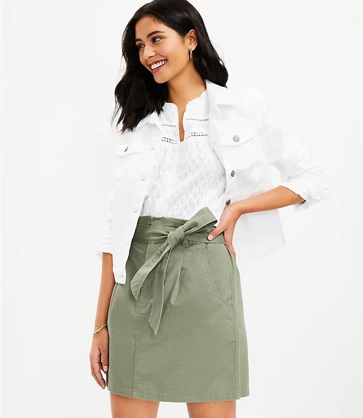 Model wearing the denim mini skirt with denim top