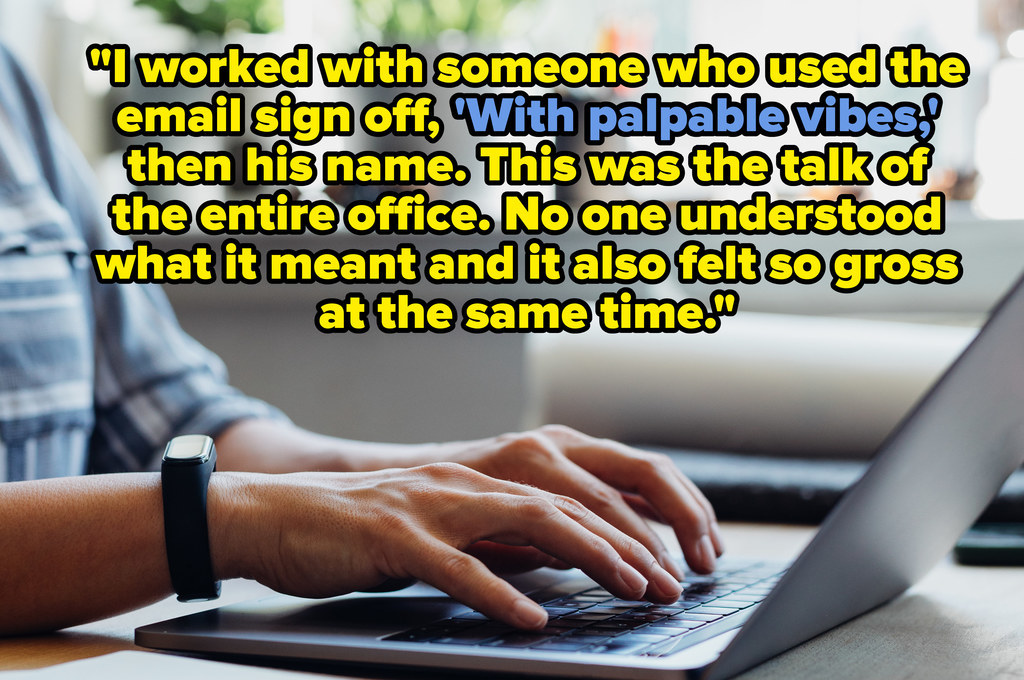 A person's hands typing on a laptop