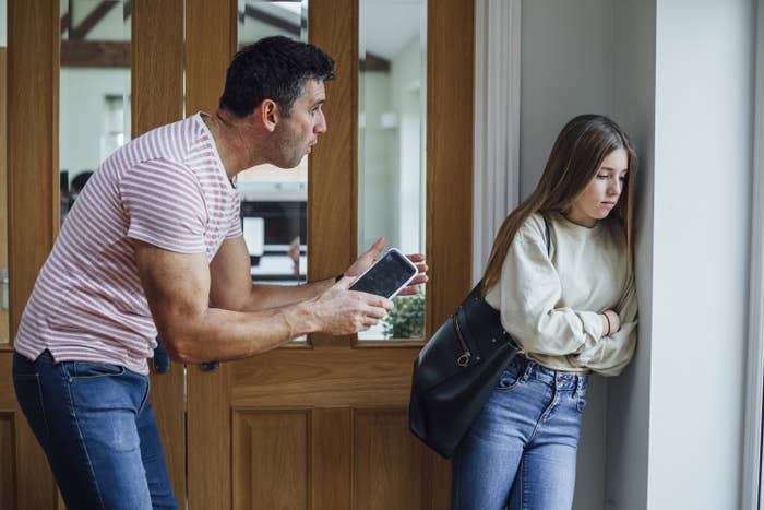 A dad yelling at his child inside their home