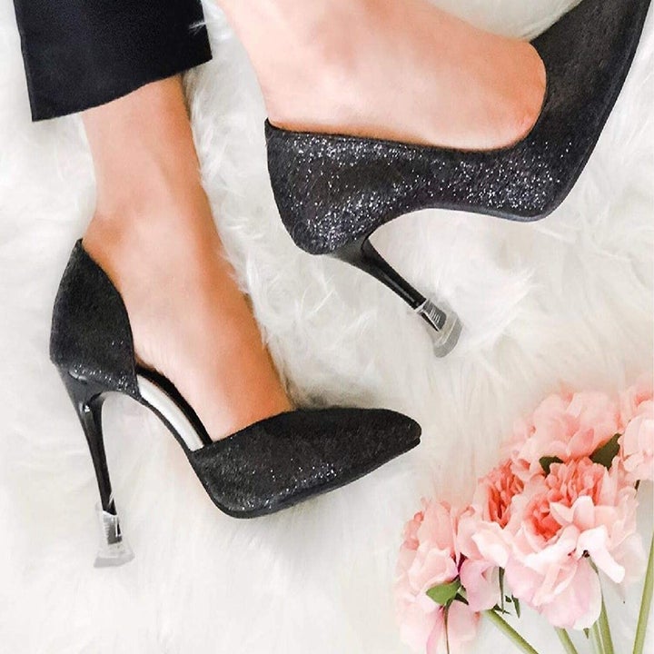 model wearing heels showing the heel caps attached