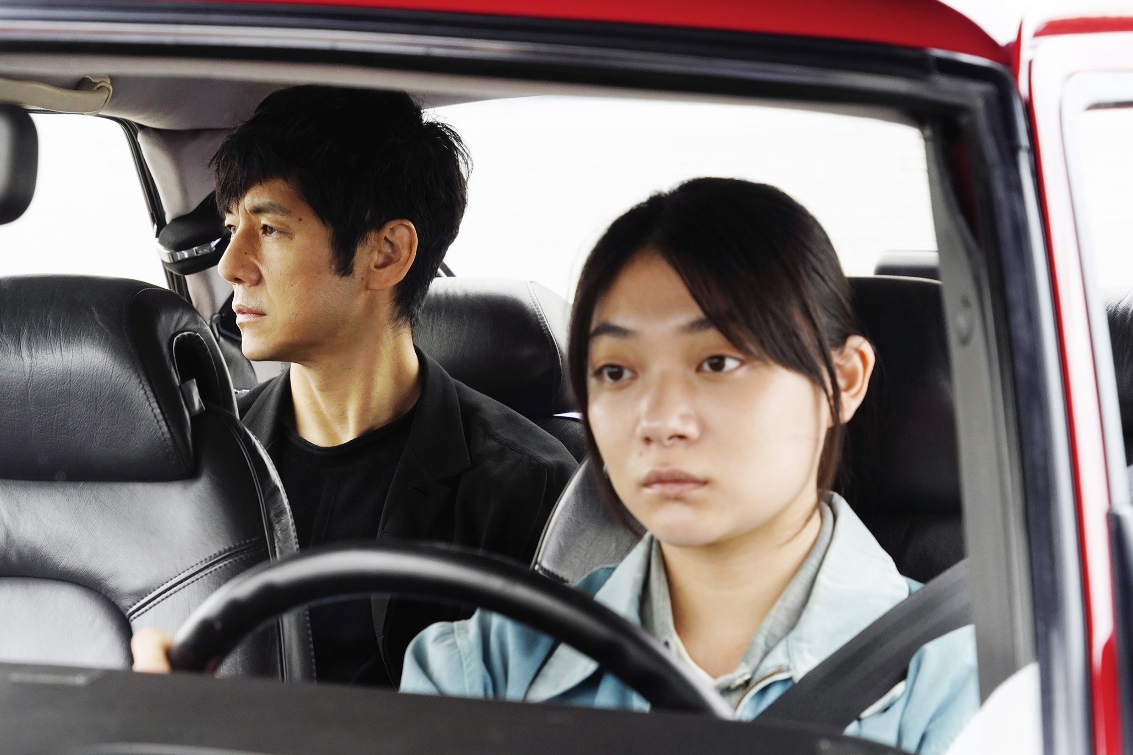 Hidetoshi Nishijima in the backseat of a car, with Toko Miura in the driver&#x27;s seat