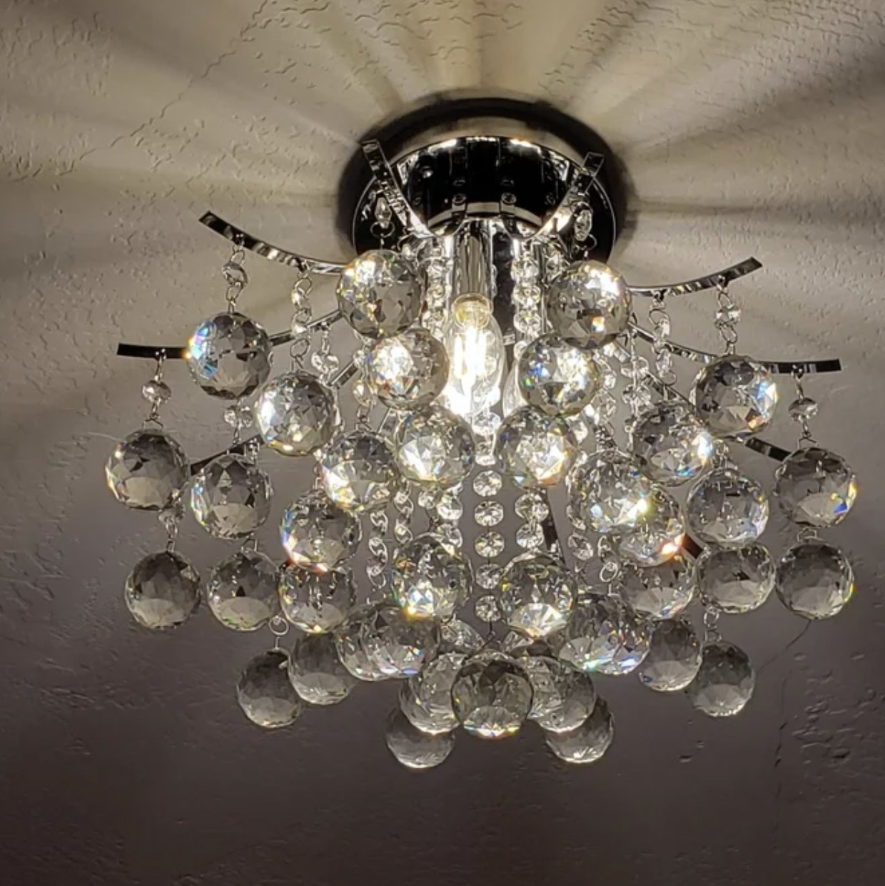 The three tiered chandelier with light on