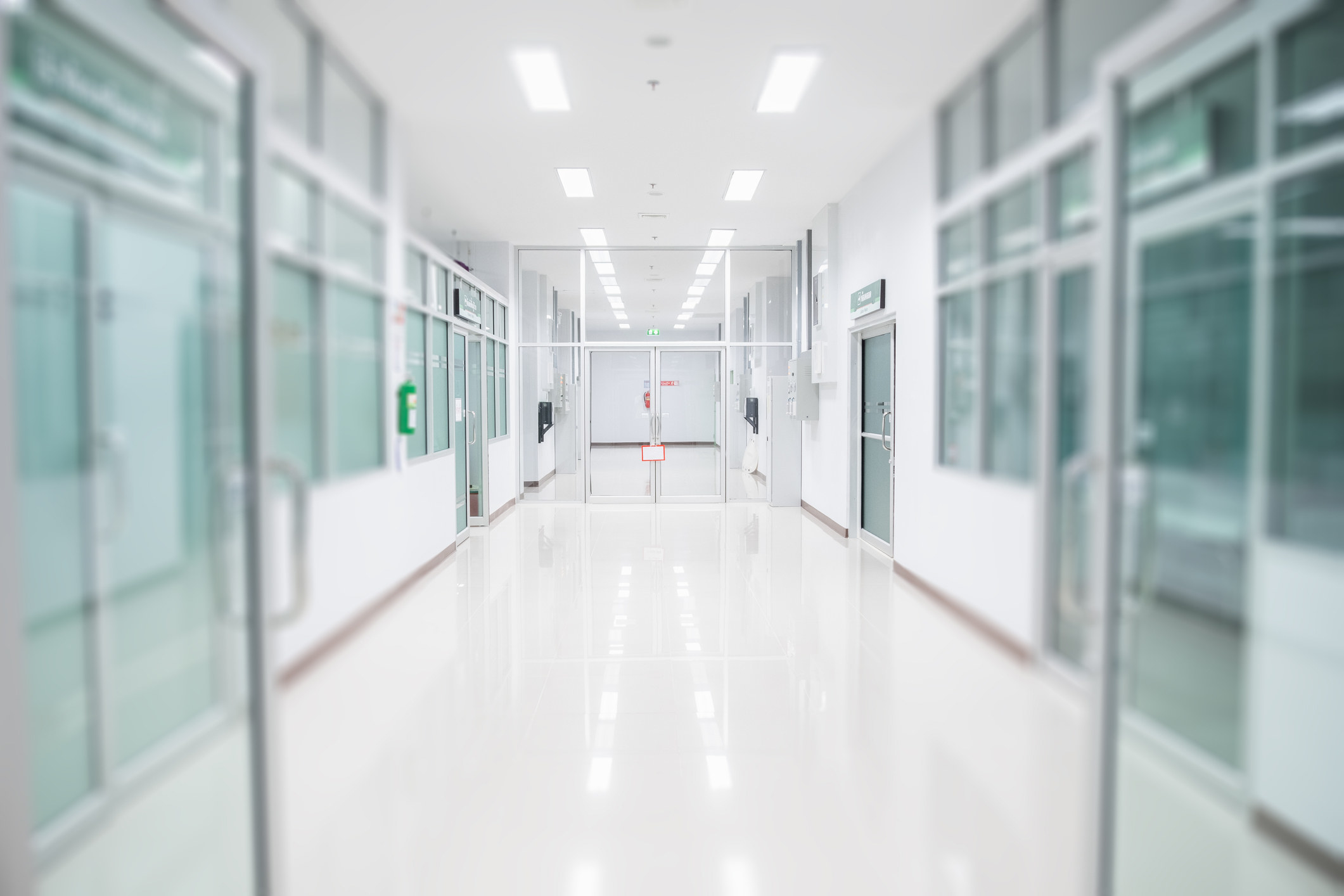A brightly-lit hallway in a hospital.