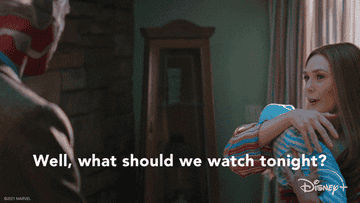 GIF of Elizabeth Olson in &quot;WandaVision&quot; saying, &quot;Well, what should we watch tonight?&quot;