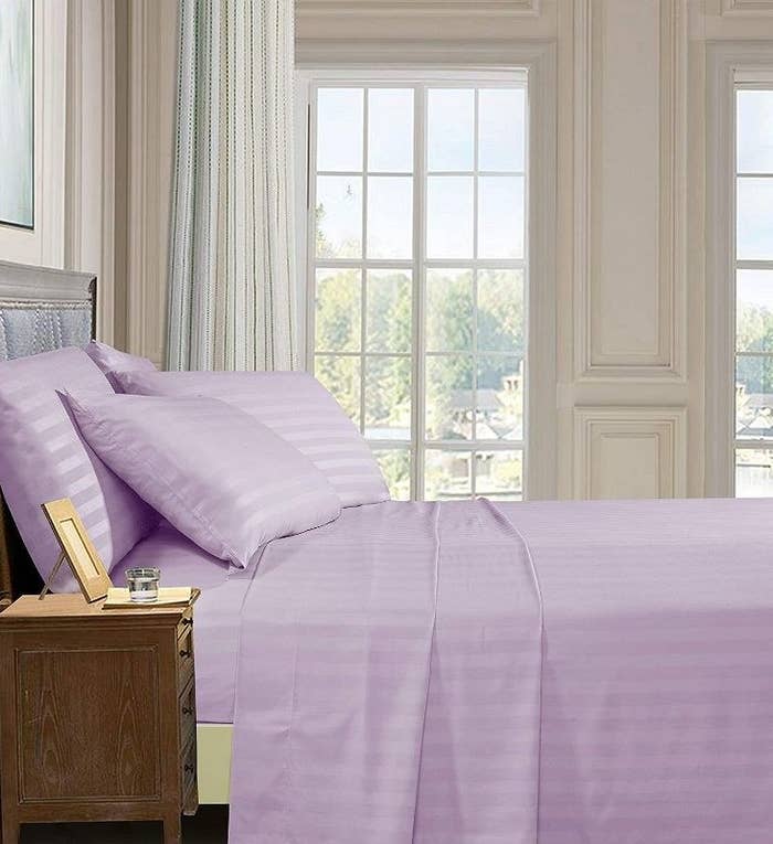 the sheets in lilac on a bed