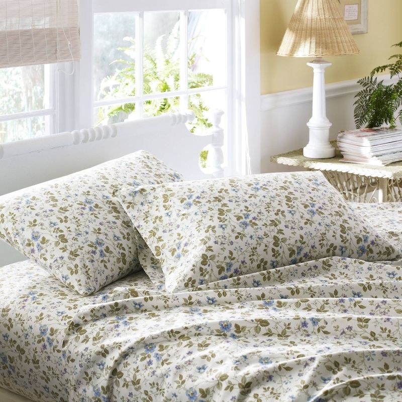 the sheet set in white with small green and blue flower detailing