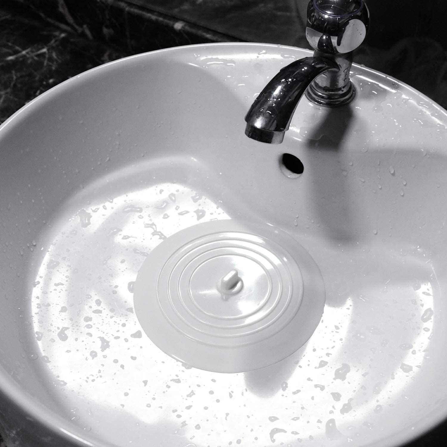 A drain stopper covering a sink drain
