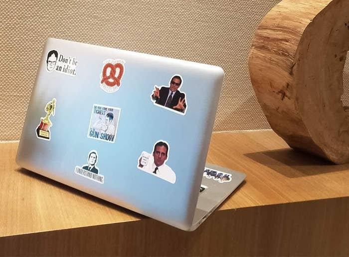 A laptop covered in stickers