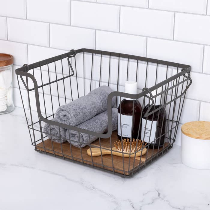 gray wire basket with wooden base