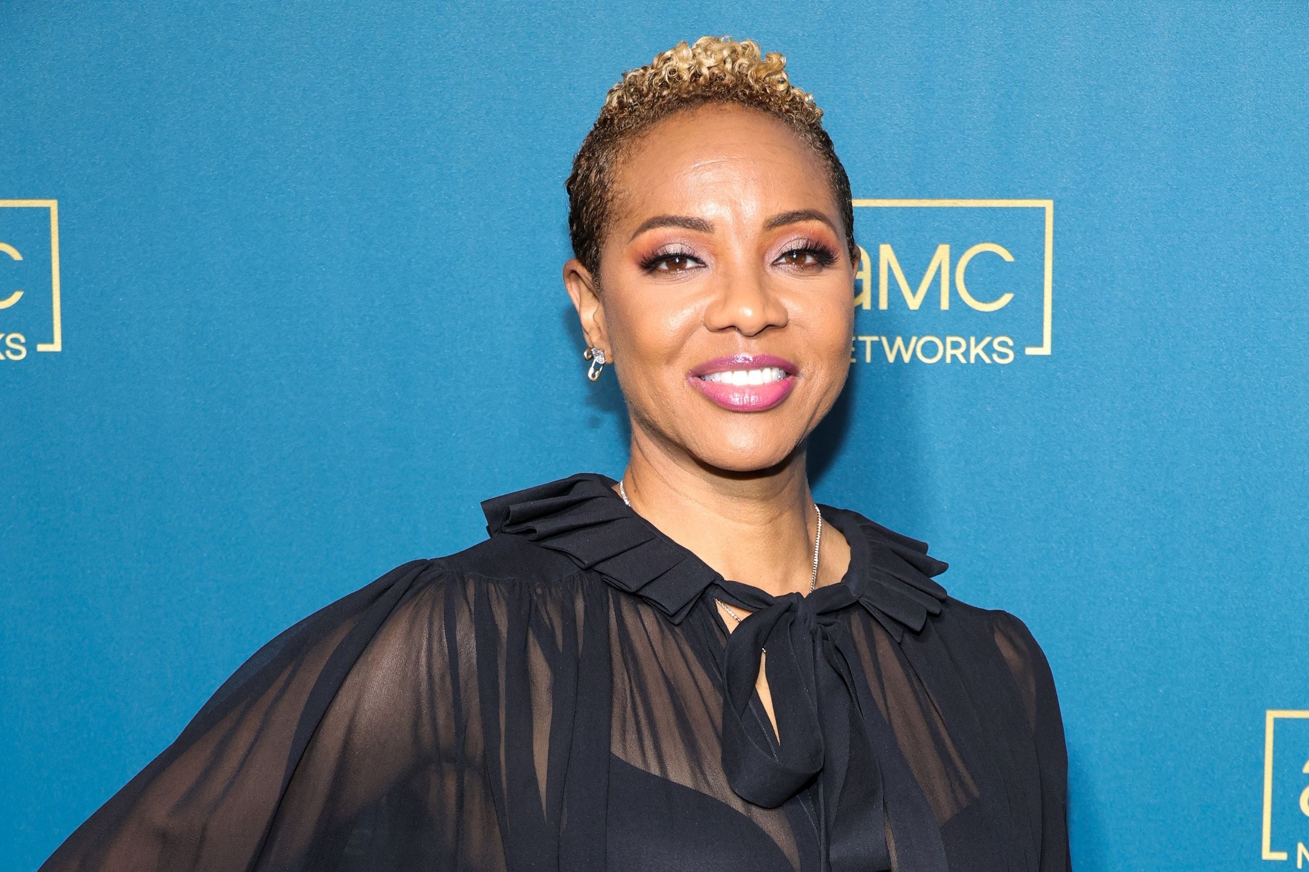 MC Lyte smiling at an event