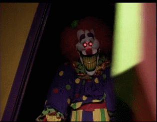 a creepy masked clown coming through the doorway