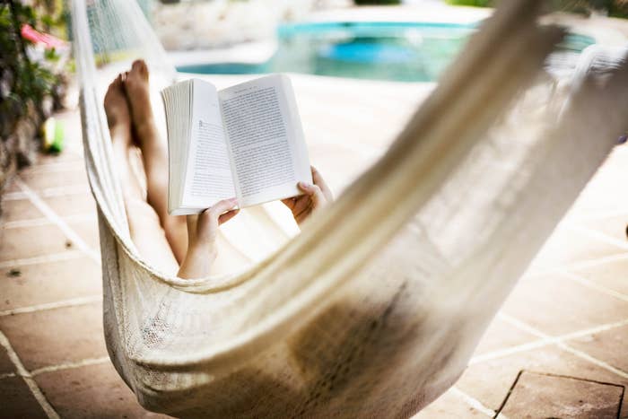A woman reading in a hammock