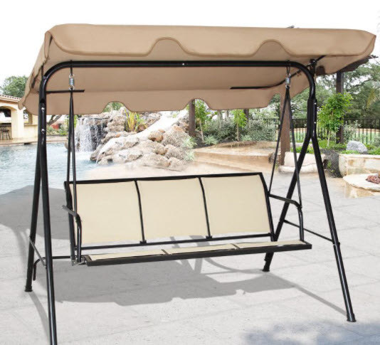 A three-seat patio swing with awning. Beige material and metal legs.