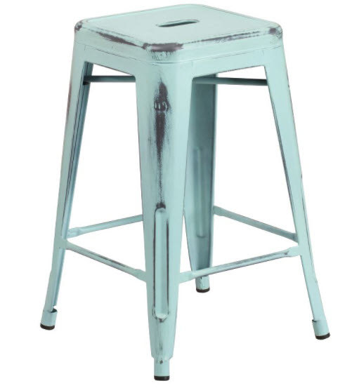 A metal and  distressed backless metal bar stool with four legs and foot rest.