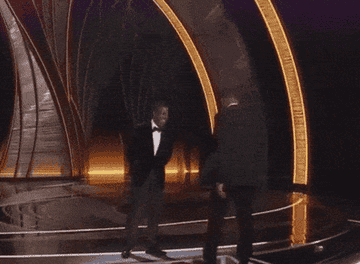 Will Smith smacking Chris Rock and walking back offstage