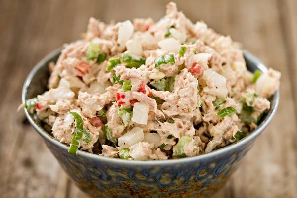 A blue ceramic bowl full of freshly made tuna salad