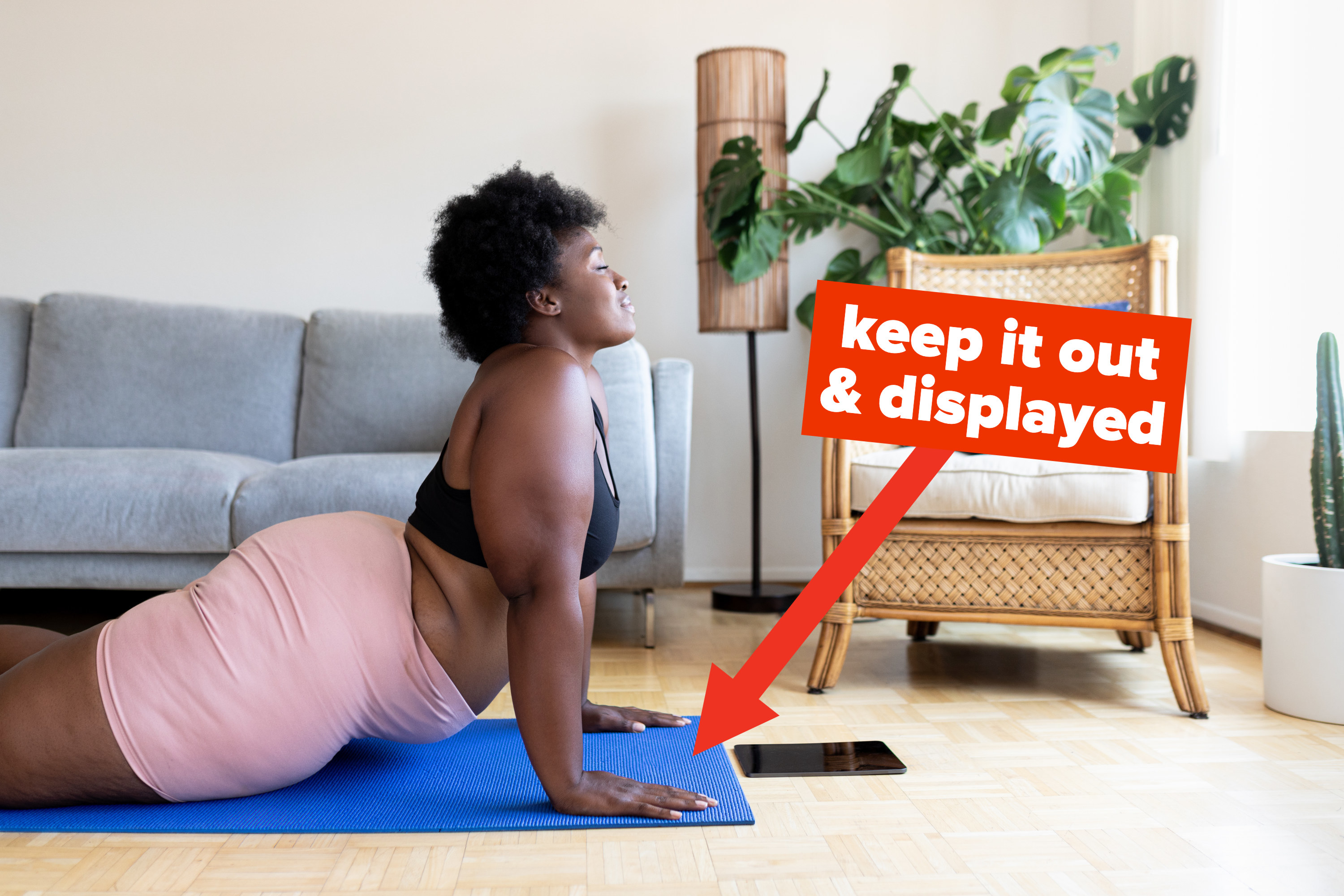 someone doing yoga with an arrow pointing to the yoga mat with text: keep it out and displayed