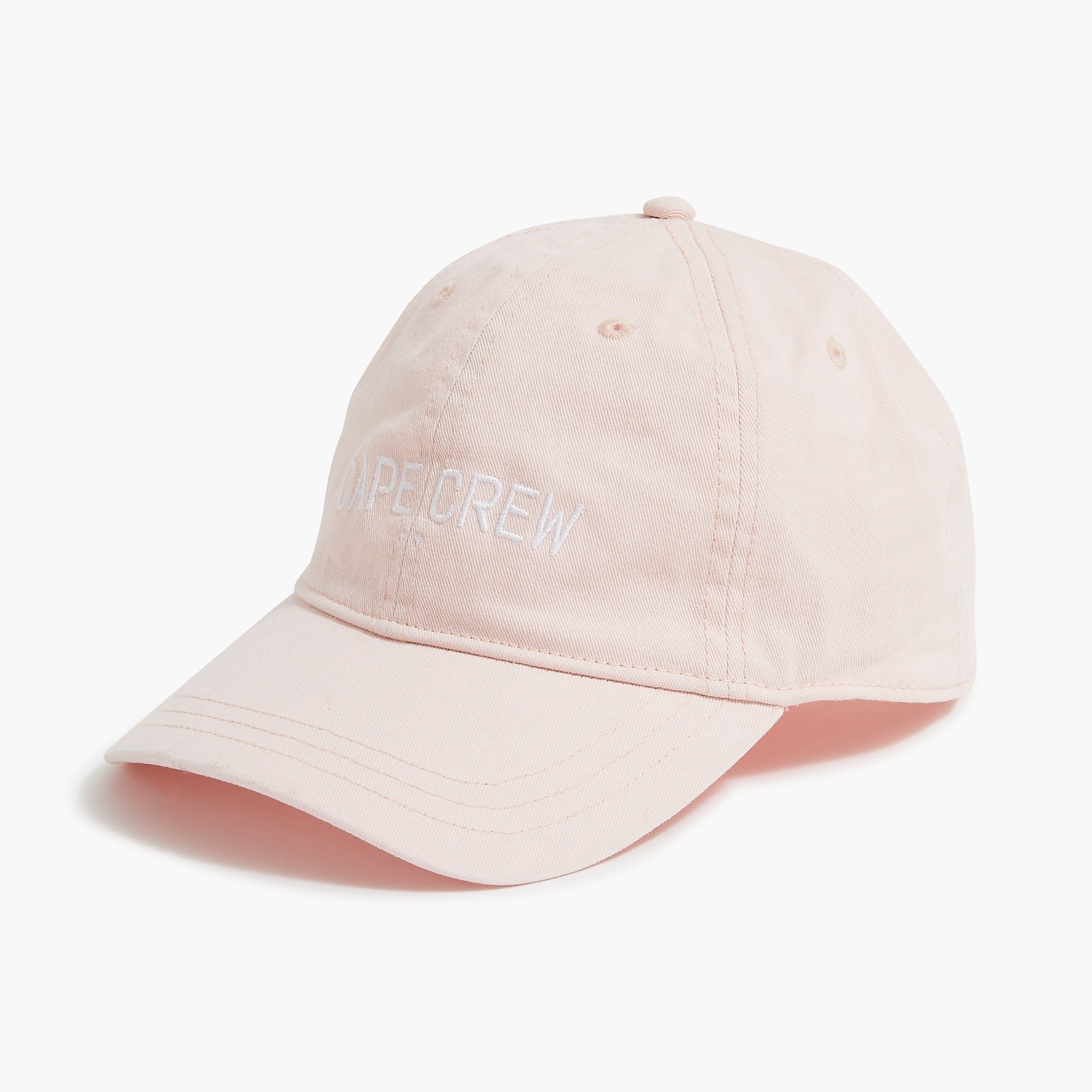 An image of a pink cotton baseball cap with a &quot;cape crew&quot; slogan