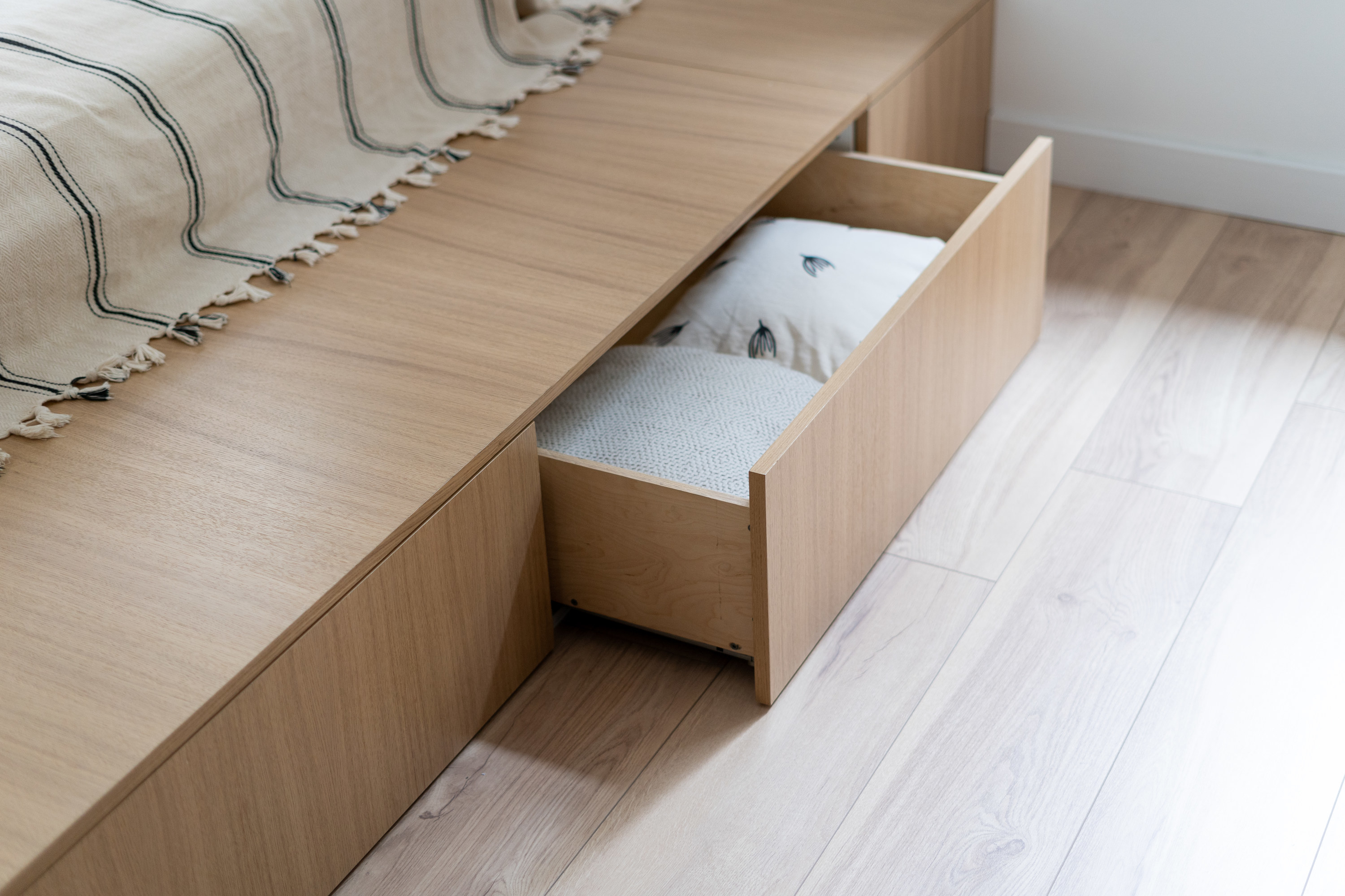 a bed frame with hidden storage drawers